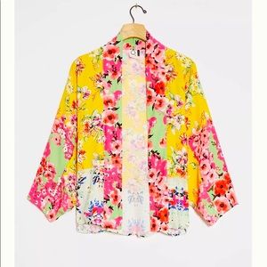 Gorgeous Anthropologie one size fits all kimono in a floral and yellow pattern.